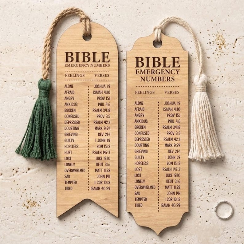 May include: Two wooden Bible bookmarks with the text "Bible Emergency Numbers". Each bookmark has a tassel, one green and one cream-coloured. The bookmarks list feelings and corresponding Bible verses.