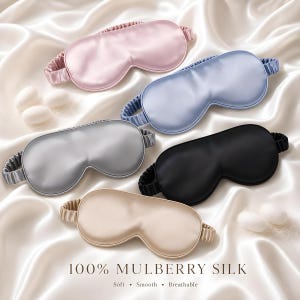 May include: Five sleep masks in pink, light blue, silver, black, and champagne, each featuring a gathered elastic strap. The text 100% MULBERRY SILK, Soft, Smooth, Breathable is printed at the bottom. The masks have a smooth, lustrous finish.
