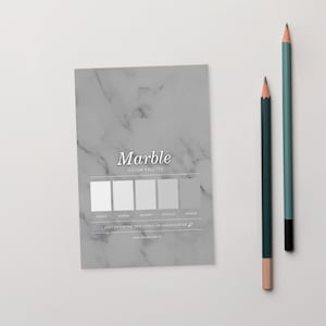May include: A marble effect colour palette card with five shades of grey, alongside two pencils. The card reads "Marble COLOR PALETTE" and includes a website address. One pencil is teal, the other is dark green.