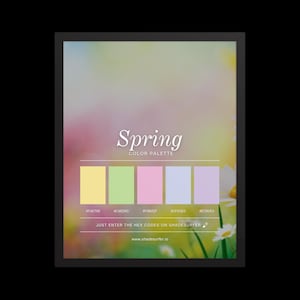 May include: A framed print showcasing a spring colour palette. The design includes the word "Spring" in elegant script, a row of colour swatches with hex codes, and the text "Just enter the hex codes on shadesurfer.io". The background is a blurred floral scene.