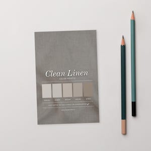 May include: A grey "Clean Linen" colour palette card with a series of neutral colour swatches. Two pencils, one teal and one dark green, are positioned to the right of the card. The card includes the text "Just enter the hex codes on shadesurfer."