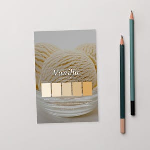 May include: A colour palette card with the word "Vanilla" and a beige colour gradient. The card features scoops of vanilla ice cream in a glass bowl. Two pencils, one teal and one dark green, are on the right.