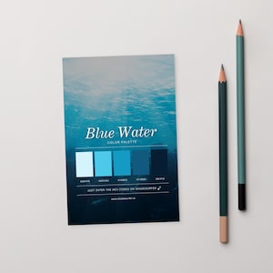 May include: A "Blue Water" colour palette card with a blue water gradient background. It shows five blue shades with hex codes. Two pencils, one dark green and one light green, are positioned to the right of the card.