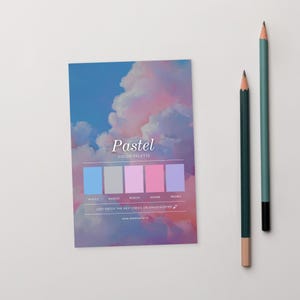 May include: A pastel colour palette card with a sky-themed background and a colour swatch. The card features the word "Pastel" and a website address. Two pencils, one green and one teal, are positioned to the right of the card.