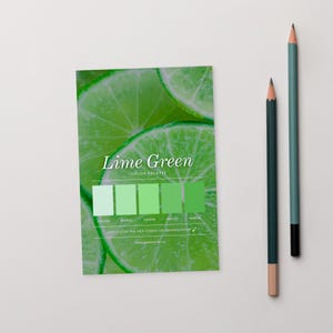May include: A colour palette card with the text "Lime Green" and a series of green colour swatches. The background features lime slices. Two pencils, one teal and one dark green, are positioned to the right of the card.