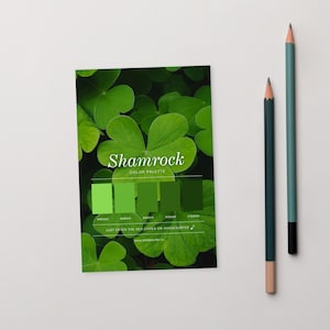 May include: A colour palette card with a shamrock theme, featuring shades of green. The card includes the text "Shamrock COLOR PALETTE" and hex codes. Two pencils, one teal and one dark green, are positioned to the right.