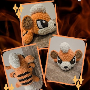 May include: Crocheted orange and black dog plushie with white accents. The plushie has a fluffy white tuft on its head and brown ears. The image includes the text "Blaze The Fire Dog" and "Nerdy Hook Nook".