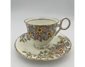 1928 Delphine China theekopje en schotel - normaal formaat - gemengd bloemenpatroon