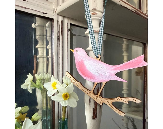 A Pretty Wooden Song Bird Decoration in Sugar Plum Pink