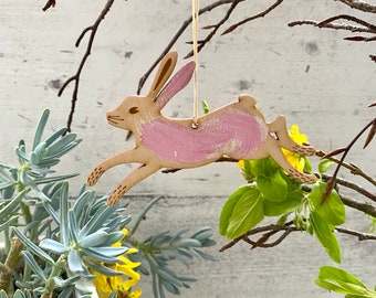 A Hand Painted Birchwood Hare Decoration in Sugar Plum Pink