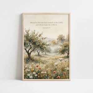May include: A framed watercolour print showing a tranquil landscape with trees, wildflowers, and a soft, hazy atmosphere. The artwork includes the text "Blessed is the man that trusteth in the LORD, and whose hope the LORD is. Jeremiah 17:7."