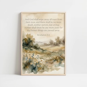 May include: Watercolor print in a light wood frame featuring a landscape scene with fields and trees in muted greens and browns. The print includes the text of Revelation 21:4, a Bible verse about wiping away tears and ending pain.