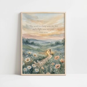 May include: Framed watercolour print showing a path through a wildflower meadow, leading to a figure with a lantern. The sky is painted in soft pastel hues. The text reads, "Thy word is a lamp unto my feet, and a light unto my path. Psalm 119:105."