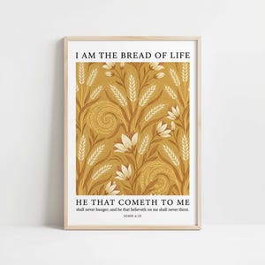 May include: Framed art print featuring the text "I AM THE BREAD OF LIFE" above a floral and wheat design in shades of gold, brown, and cream. The bottom of the print includes the text "HE THAT COMETH TO ME" and a Bible verse.