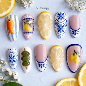 May include: A white ceramic mug with a black handle and the text "But First, Coffee" in a bold, black font. The mug is set against a blurred background, highlighting its clean design. The mug is approximately 4 inches tall.