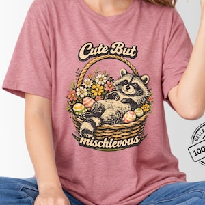Damen-Shirt mit Waschbärmotiv, niedliches und freches T-Shirt, Waschbär-Shirt mit Osterkorb-Motiv, T-Shirt mit floralem Tiermotiv