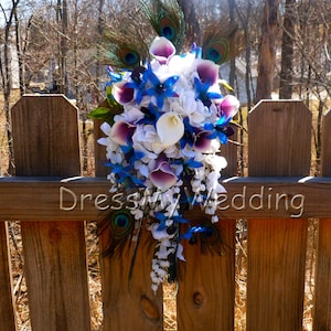 Cascading Purple blue dendrobium orchid bouquet peacock feathers, hydrangeas, wisterias, picasso calla lilies