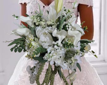 Whimsical garden bouquet with white peonies, callas, babys breath, delphiniums, lilies and eucalyptus, Italian ruscus