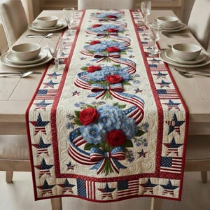 May include: Quilted table runner with a patriotic theme. Features bouquets of red roses and blue hydrangeas, with red, white, and blue ribbons and star and flag patterns. The runner is placed on a wooden table, ready for a festive occasion.