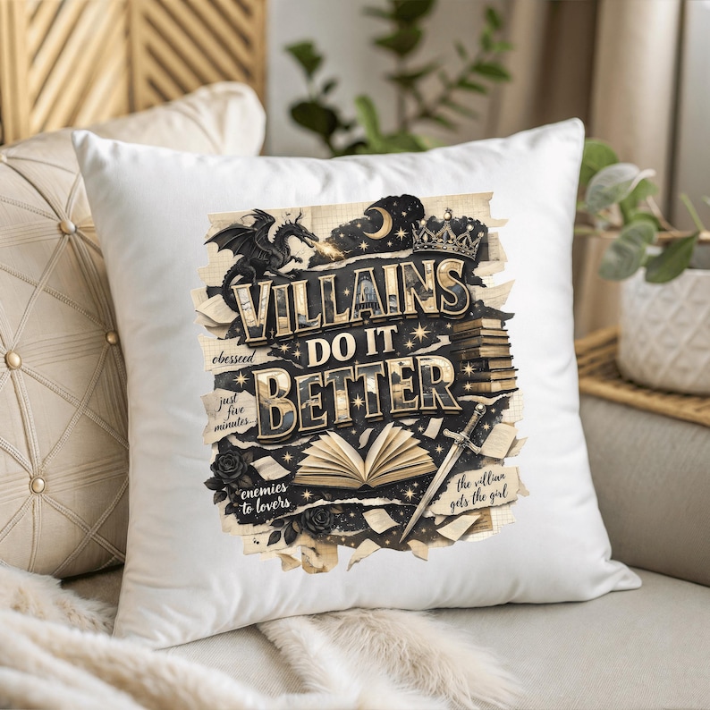 May include: White square pillow with the text "VILLAINS DO IT BETTER" in gold and black. The design includes a dragon, crown, sword, and open book illustrations. Additional text includes "obesseed", "just five minutes", "enemies to lovers", and "the villian gets the girl".