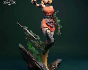 May include: A detailed figurine of a woman in an orange dress, pointing forward. She has blonde hair and is wearing black armor on her legs and arm. A sword and green, leafy accents are included in the design. The base is a dark rock formation, and the logo "SCULATIVE" is visible.