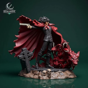 May include: A detailed figurine of a character in a black suit and red cape, holding a gun. A red demonic dog and a tombstone are also featured. The base includes skulls and the logo "SCULATIVE".