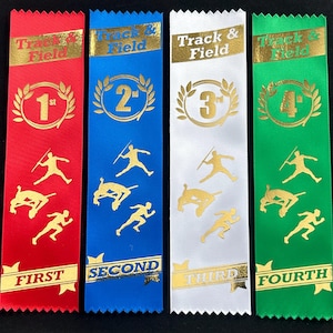 May include: Four satin ribbons for track and field events. The ribbons are red, blue, white, and green, with gold text and graphics. Each ribbon displays a place: 1st, 2nd, 3rd, and 4th, along with track and field event illustrations.