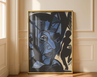 May include: A framed art print featuring a bold, high-contrast woodcut-style illustration. The image displays a large, stylized blue and black face with intricate line work, positioned next to a smaller, solid black silhouette of a human figure.