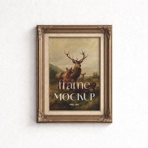 May include: A framed artwork featuring a painting of deer in a natural landscape. The frame is ornate with a gold finish. The text "frame MOCKUP" is displayed in the lower center of the image, with "PSD - JPG" below it.
