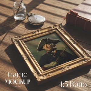 May include: A gold-colored framed portrait of a man in a black coat and hat, with a walking stick. The frame is ornate. A pocket watch, inkwell, and book are also on the wooden surface. The text "frame MOCKUP" and "4:5 Ratio" are visible.