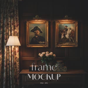 May include: Two framed portraits with ornate gold frames hang above a wooden table. The portraits are lit by small lamps. A bouquet of pink roses sits on the table, along with decorative boxes. The text "frame MOCKUP" is displayed on the table.