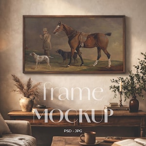May include: A framed vintage painting depicts a brown horse with a saddle, a man in a coat, and two dogs. The artwork is set in a dark wooden frame. The image is a mockup with the text "frame MOCKUP" and "PSD - JPG".