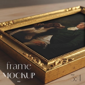 May include: A gold-colored ornate picture frame with a classic painting inside. The painting depicts a person with a dog. The frame has decorative detailing and the text "frame MOCKUP" and "3:4" is visible.