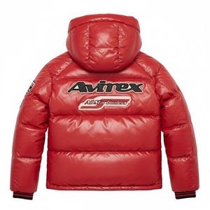 May include: A red puffer jacket with a hood. The jacket features the brand name "Avirex" in white and black lettering across the back, with "All Star Dualers" below. The jacket has black and red striped cuffs.