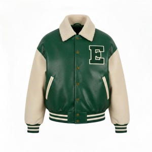 May include: Green and cream-colored varsity jacket with a cream-colored collar. The jacket features cream-colored sleeves and a white embroidered "E" on the chest. The jacket has a button-up front and striped detailing on the cuffs and hem.