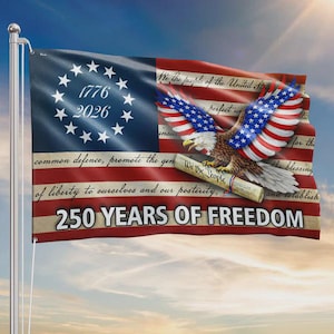 May include: A patriotic flag featuring the American flag design with an eagle and the text "250 YEARS OF FREEDOM." The flag includes the years 1776 and 2026, and a quote from the U.S. Constitution.