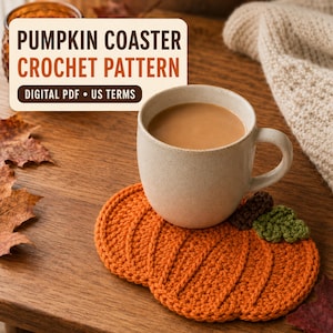 May include: A pumpkin-shaped orange crochet coaster with a brown stem and green leaf, supporting a speckled beige ceramic mug filled with a light brown beverage. The image includes text reading PUMPKIN COASTER CROCHET PATTERN DIGITAL PDF US TERMS.