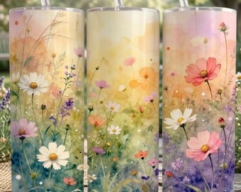 May include: Three stainless steel tumblers with floral designs. Each tumbler features a different watercolor-style illustration of wildflowers in shades of pink, white, purple, and orange against a gradient background. Clear straws are inserted into the lids.