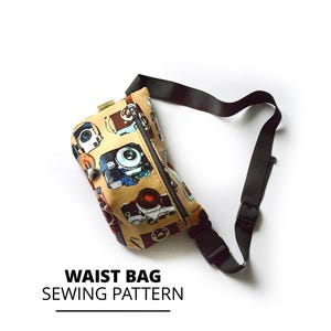 May include: Tan waist bag with a black strap, featuring a repeating pattern of vintage cameras in various colors. The text "WAIST BAG SEWING PATTERN" is printed in black.