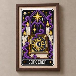 May include: A framed cross-stitch embroidery featuring a central book with a sun and moon design, surrounded by purple smoke, lit candles, and a gothic archway. The word SORCERER is stitched in white capital letters at the bottom of the piece.
