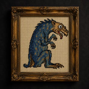 May include: A cross-stitch embroidery of a blue and tan creature with a long snout, sharp claws, and a single large eye, displayed in an ornate, antique-style gold frame with intricate carvings and a rectangular border on a beige fabric background.