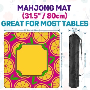 May include: A square Mahjong mat with a vibrant pink background and a pattern of yellow citrus fruit slices. The mat measures 31.5 inches (80cm) square and includes a black carrying case. The text on the mat reads "MAHJONG MAT (31.5" / 80cm) GREAT FOR MOST TABLES."