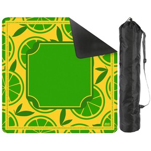 May include: A yellow and green yoga mat with a lime slice pattern and a large green square in the center. A black carrying bag is on the right side of the mat.