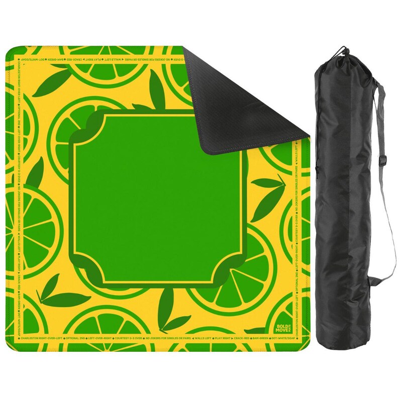 May include: A yellow and green yoga mat with a lime slice pattern and a large green square in the center. A black carrying bag is on the right side of the mat.