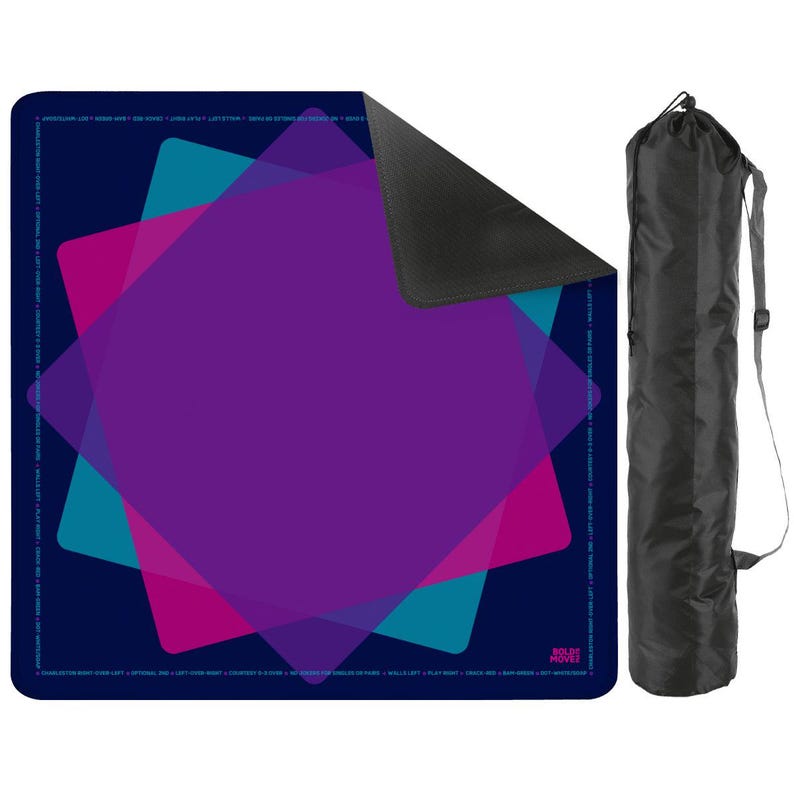 May include: A dark blue yoga mat with overlapping geometric shapes in purple, pink, and teal. The mat has a black underside and includes a black carrying bag with a shoulder strap. The words "ROLES MOVES" are visible.