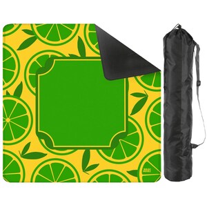 May include: A yellow picnic blanket with a lime slice pattern and a large green central area. Includes a black carrying bag with a shoulder strap. The blanket is designed for outdoor use.