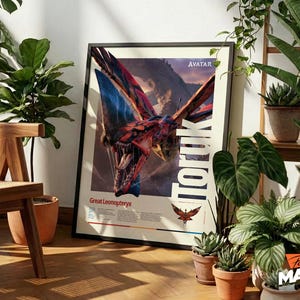 May include: Framed poster featuring a Great Leonopteryx from the movie Avatar. The artwork showcases a detailed illustration of the creature with open jaws, set against a mountain backdrop. The poster includes the word 'TORUK' in large white letters.