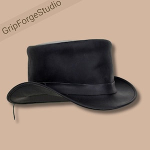 May include: A black top hat with a wide brim and a black band. The hat has a tall, cylindrical crown and is made of a smooth material. The text "GripForgeStudio" is in the upper left corner.