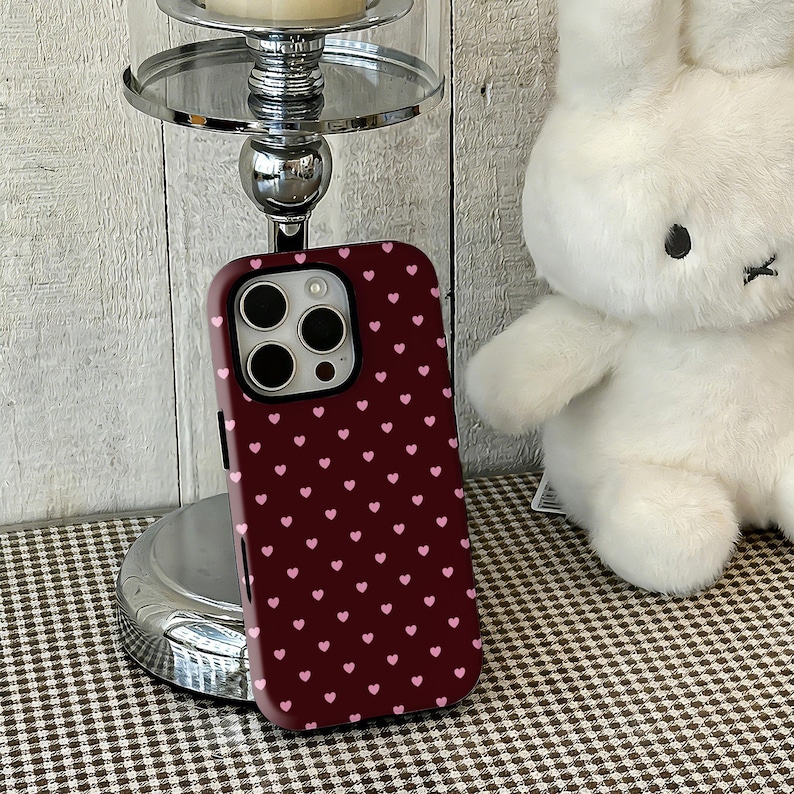 This Vintage Coquette Burgundy & Pink Heart phone case combines sweet heart motifs with a simple, cute design, creating a playful and girly look. The rich burgundy and soft pink tones blend elegantly for a charming, vintage-inspired aesthetic. High-quality printing captures every detail, while a durable protective structure guards against scratches, drops, and daily wear. Slim, lightweight, and comfortable to hold, it’s perfect for anyone seeking a stylish, retro, and adorable phone cover.