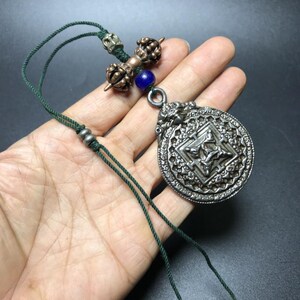 May include: A set of three ceramic mugs with a speckled, matte finish. The mugs are in shades of cream, light gray, and dark gray. Each mug has a simple, modern design and a rounded handle.